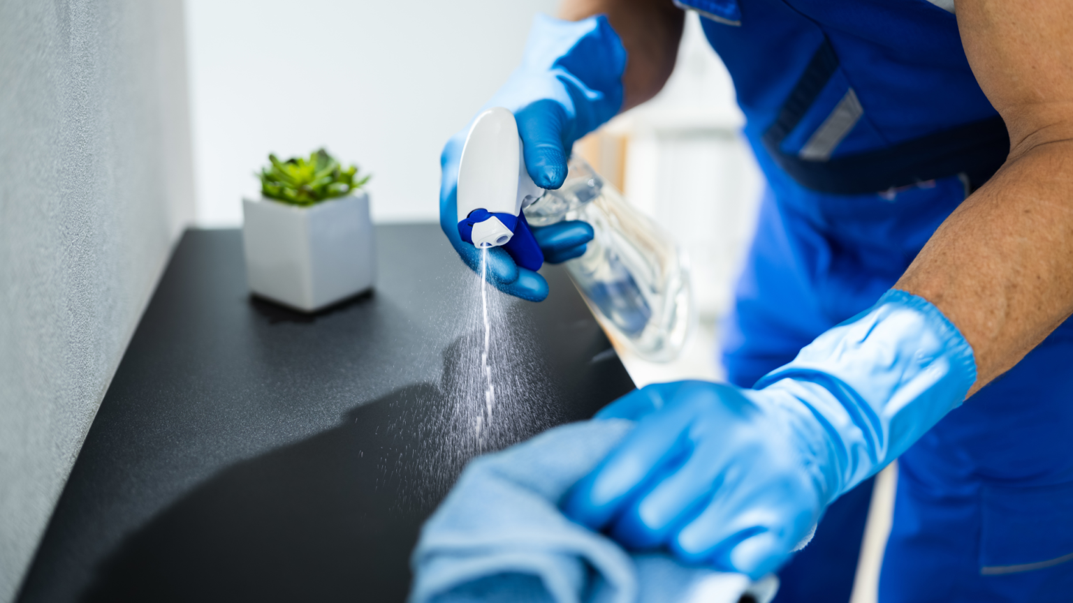 Cleaner using mobile app to track jobs and schedule office Cleaning